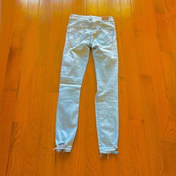 AMERICAN EAGLE NEXT LEVEL STRETCH DISTRESSED ROW HEM MID RISE LIGHT BLUE SIZE 00 - Picture 2 of 6